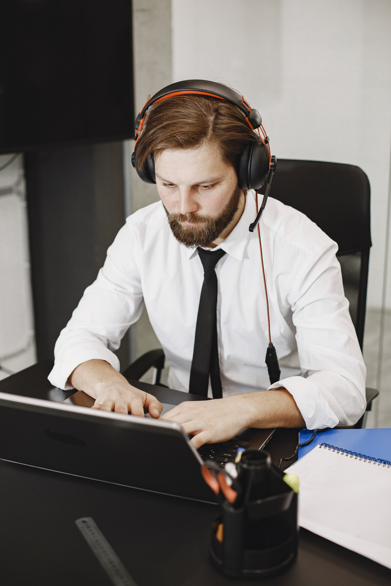 Man Using Headset in Office 